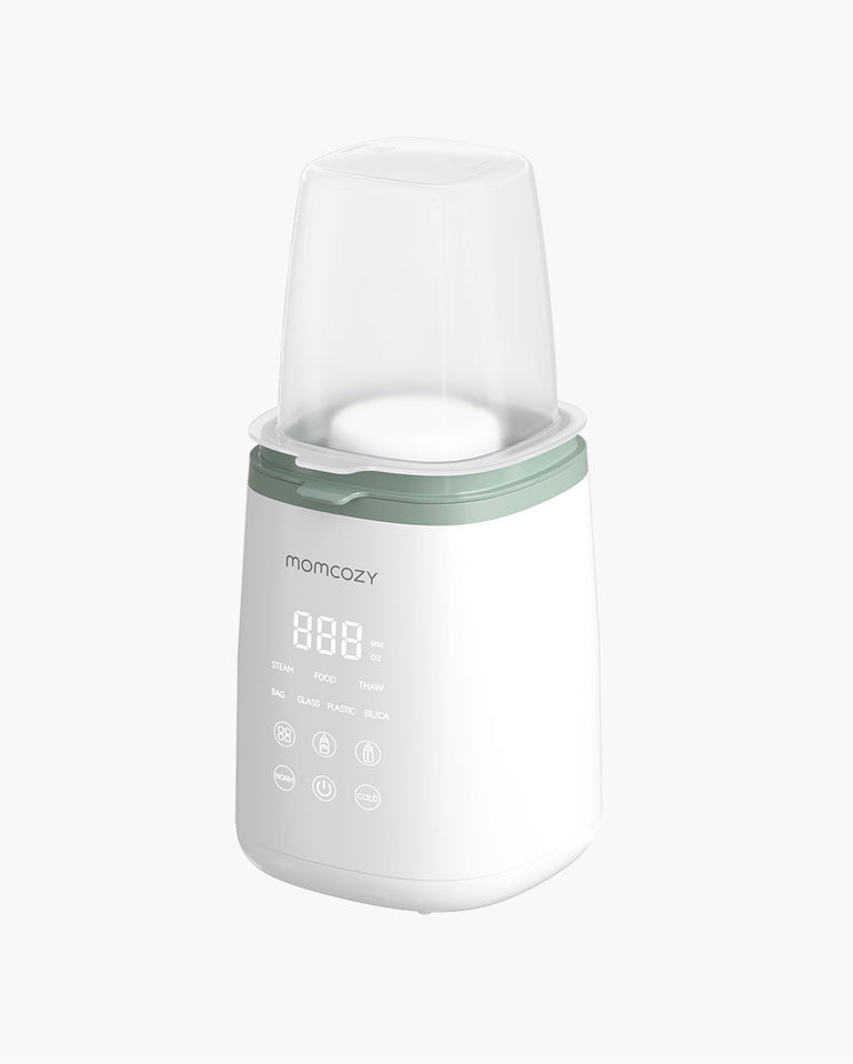 Translation missing: en.Momcozy 6-in-1 Fast Baby Bottle Warmer with digital display, green top, and protective cover for warming bottles, heating food, and thawing frozen milk